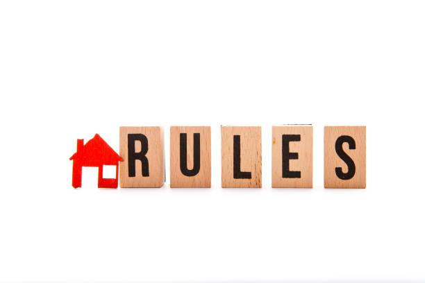 House Rules - block letters with red home / house icon with white background